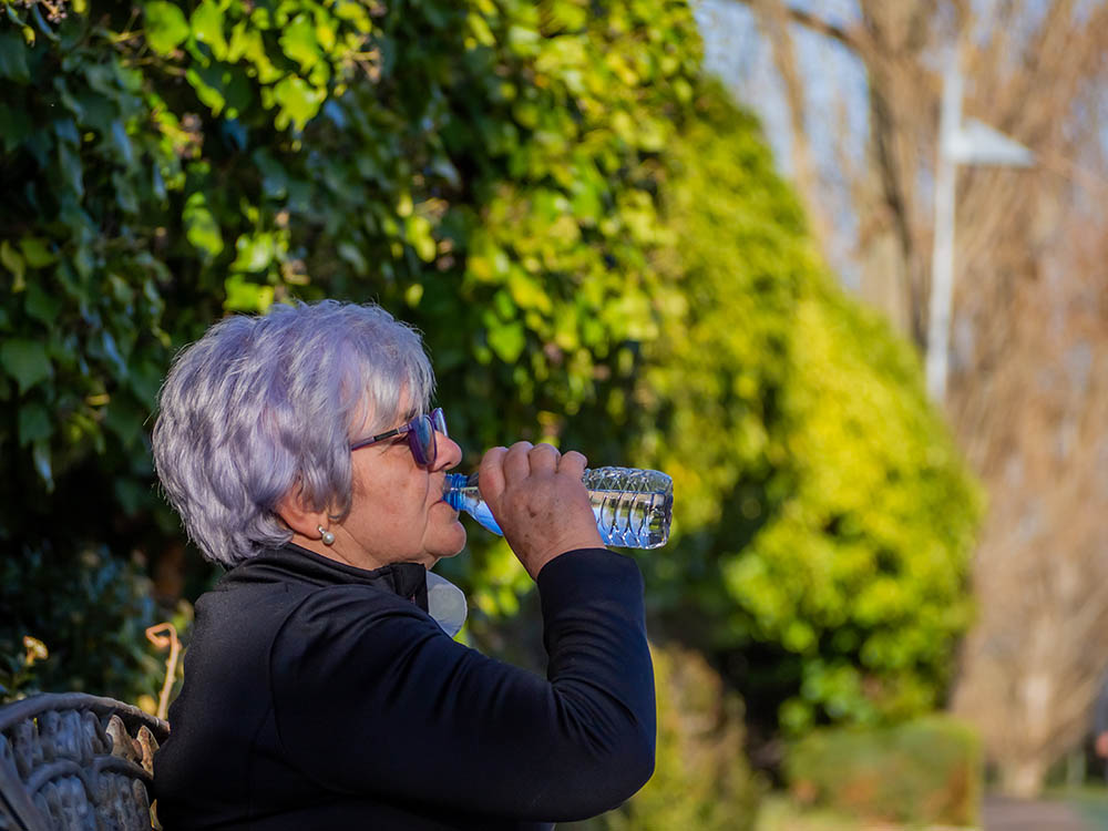 Woman drinking bottled water